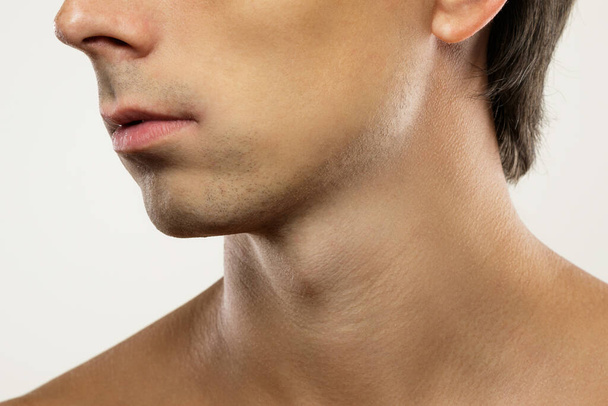Men skin care and beauty. Closeup of clean-shaven male face. - Zdjęcie, obraz