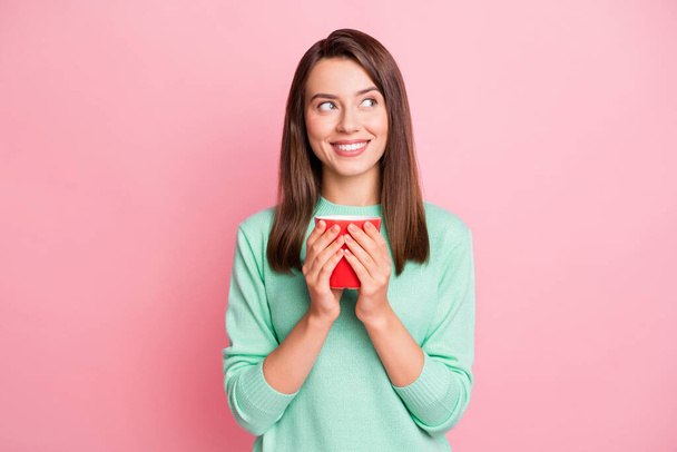 Photo of rest cute brunette straight hair young woman hold coffee look empty space wear sweater isolated on pink color background - Photo, image