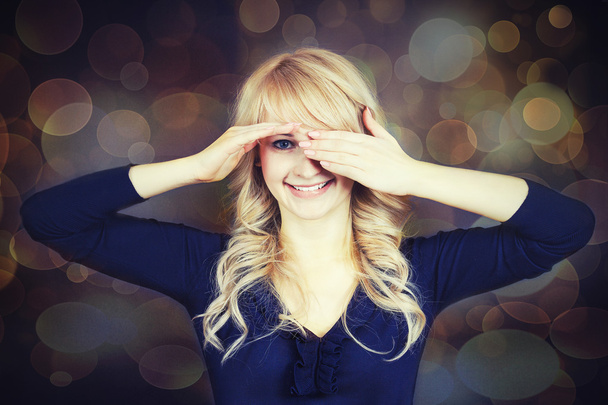 Woman covering her eyes with hands - Photo, Image