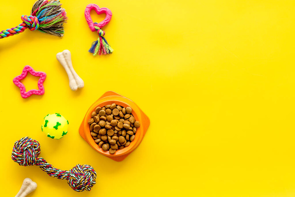 Pet toys and dry food for dogs and cats. Top view - Fotografie, Obrázek