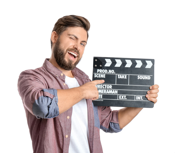 Bearded man with movie clapper on white background - Photo, Image