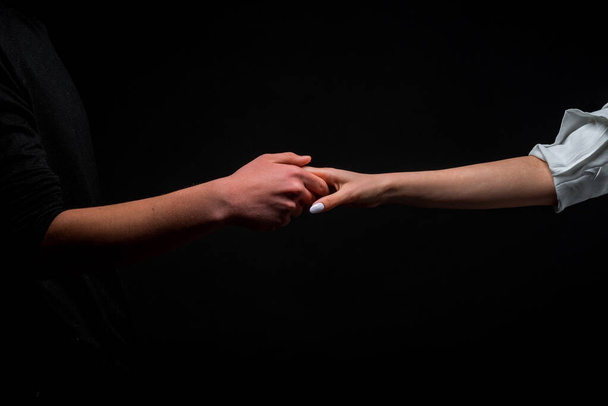 Soft and gentle touch between the hands of a man and a woman - Fotó, kép