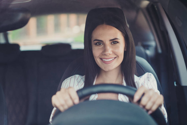 Close-up portrait of her she nice attractive lovely brunette cheerful cheery content smart clever businesslady enjoying riding new comfortable vehicle motorway leisure going home - Foto, Imagen