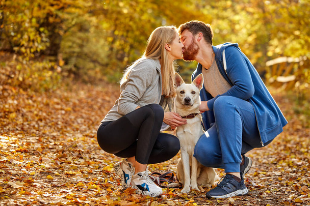portrait of lovely couple in the forest, kissing - Foto, Bild