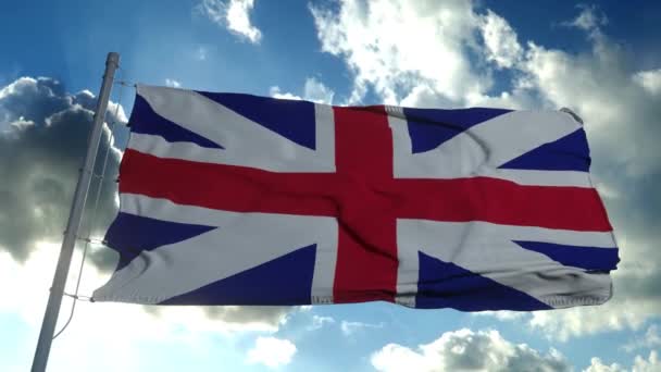 Yhdistyneen kuningaskunnan lippu puhaltaa tuulessa hidastettuna kirkasta sinistä taivasta vasten - Materiaali, video
