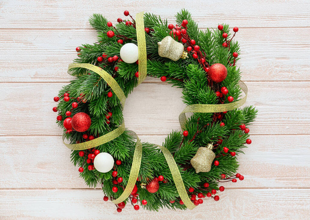 Beautiful Christmas wreath on wooden background - Foto, afbeelding