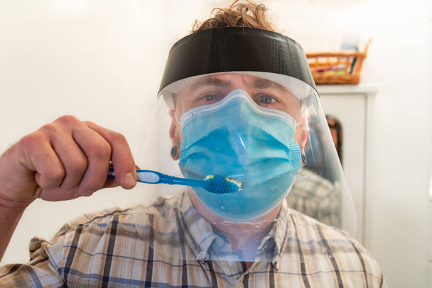 Living with coronavirus safety mask and visor - Photo, Image