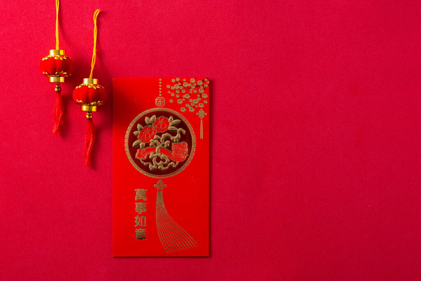Different Chinese new year festival envelopes on red background. - Foto, afbeelding