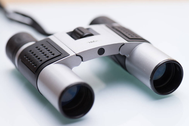 A closeup shot of stylish binoculars on an isolated white background with lenses - Fotografie, Obrázek