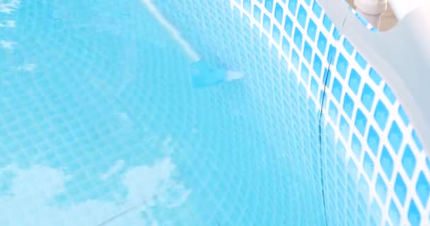 cleaning swimming pool with a special brush - Footage, Video