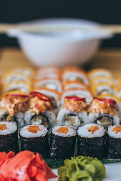 Sushi with salmon, cream cheese Philadelphia, cucumber and wasabi - Photo, Image
