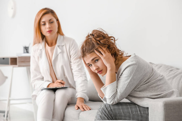 Psychologist working with teenage girl in office - Photo, Image