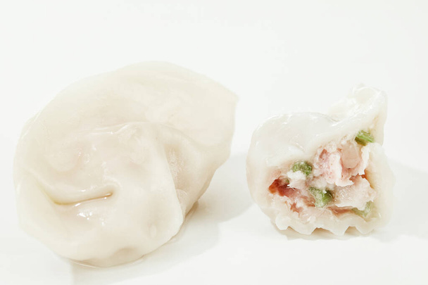 An isolated shot of meat stuffed dumplings on white background - Photo, image