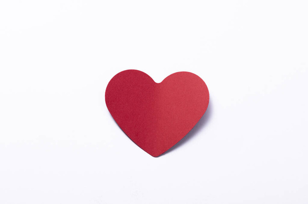 A red heart on white background - Foto, afbeelding