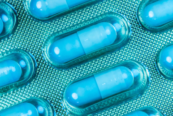A top view shot of medical blue capsules - concept of new normal - Fotó, kép