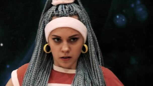 Young disgruntled exasperated woman with dreadlocks and head bandage looking into camera - Footage, Video