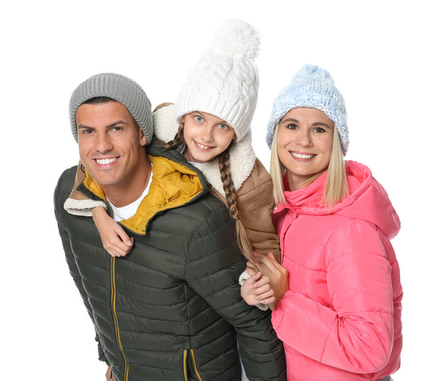Happy family with daughter in warm clothes on white background - Foto, immagini