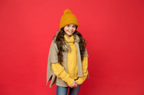 Beaming girl. stay cozy and comfortable. happy childhood. cold season look for teen girl. knitted clothing style. take care of health. cheerful child wear warm winter clothes. seasonal kid fashion - Fotó, kép