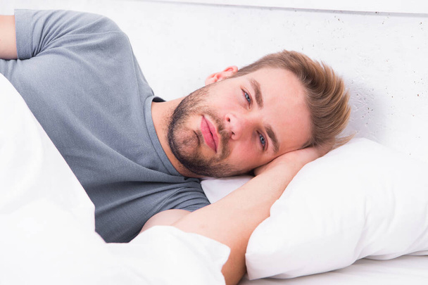 Tips sleeping better. Maintaining consistent circadian rhythm is essential for general health. Man handsome guy sleeping. Get enough amount of sleep every night. Bearded man sleeping face relaxing - Foto, afbeelding
