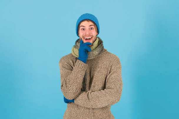 When weather turns chilly. Happy man in winter style blue background. Handsome guy in casual comfy style. Winter fashion and accessories. Keep warm in style. Maintaining your style is easy - Foto, Bild