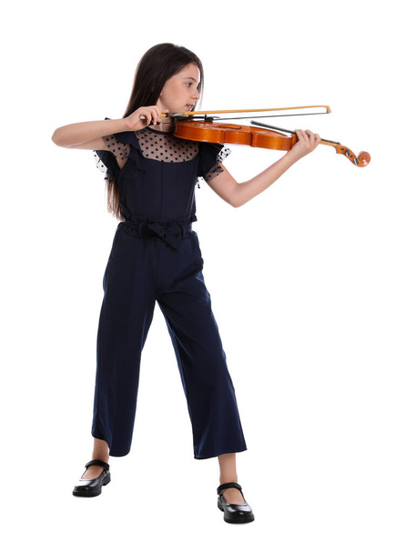 Preteen girl playing violin on white background - Zdjęcie, obraz