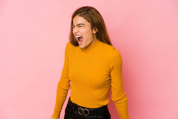 Young skinny caucasian teenager girl shouting very angry, rage concept, frustrated. - 写真・画像