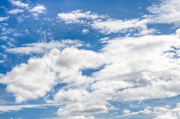 A beautiful view of the fluffy white clouds in the blue sky - great for wallpapers - Foto, Imagen
