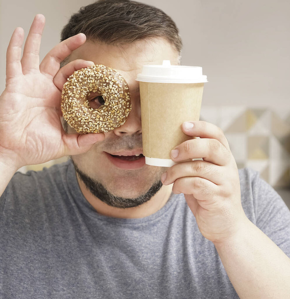 Sweet life.  bearded man on kitchen background.  mature man.    donut dessert and coffee cup. chocolate doughnut. temptation while diet. - Foto, Bild