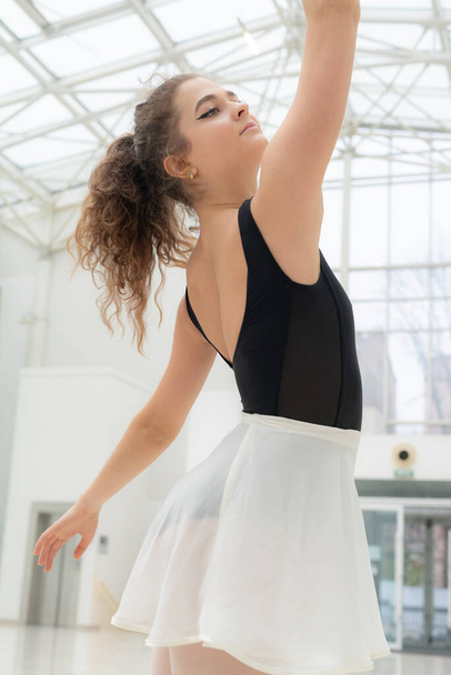 Beautiful flexible slender young girl ballerina. Ballet - 写真・画像