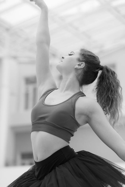 Black and white photo of flexible slender young girl ballerina. BW - Valokuva, kuva