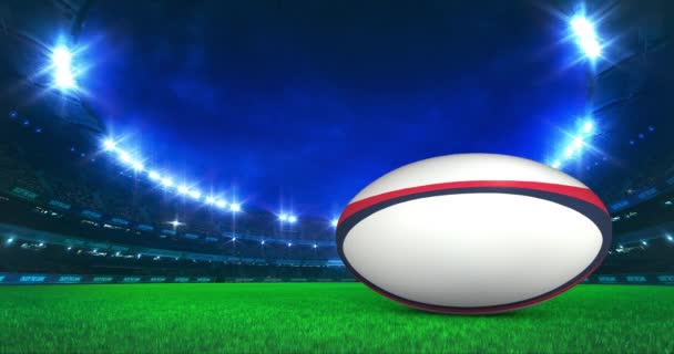 Moderni Rugby Stadium loistaa valot ja pallo liikkeen nurmikentällä. Ammattilaisurheilu 4k video tausta muokattu saumaton silmukka. - Materiaali, video