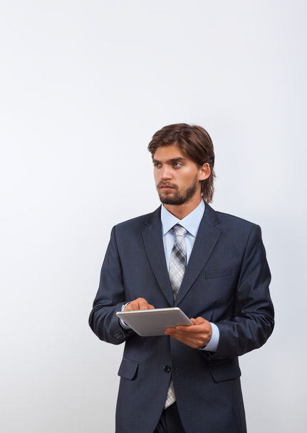 Businessman holding tablet - Фото, изображение