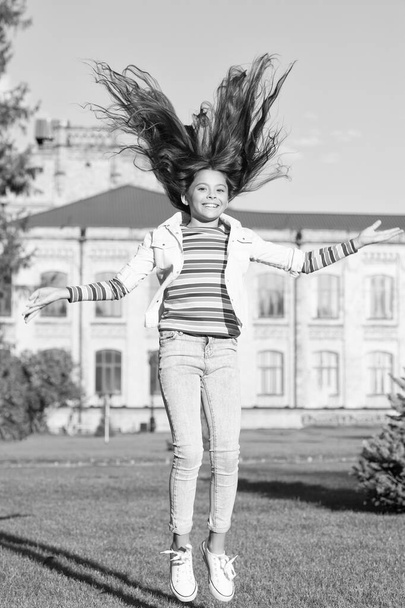 Happiness and joy. Carefree and cheerful. Feeling free. Extreme energy. Freedom concept. Schoolgirl back to school. Childhood happiness. Smart small happy girl ready to study. fashion and beauty - Foto, Imagen