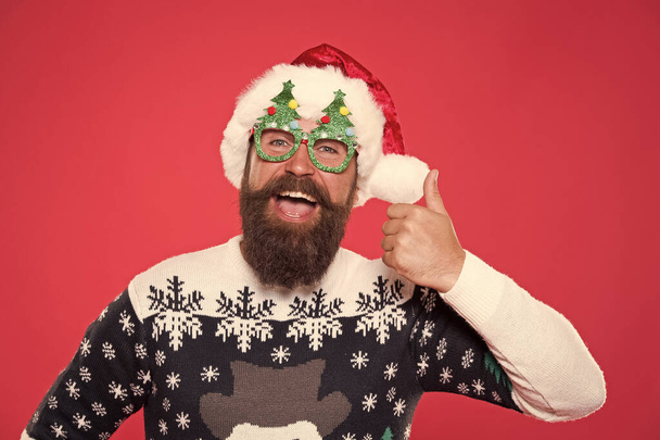 Holiday accessories santa party. Christmas and New Year celebration. Solution concept. Santa is coming. Santa man wear christmas tree party glasses. Inspired face. Happy bearded man with santa look - Foto, afbeelding