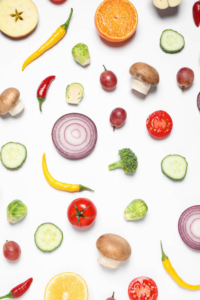 Fresh organic fruits and vegetables on white background, flat lay - Фото, зображення