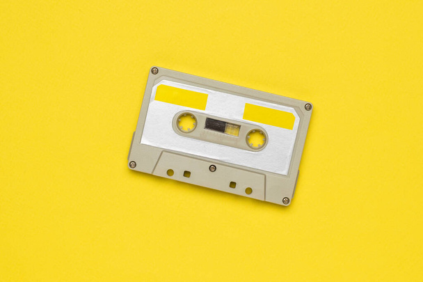 Vintage tape recorder on a yellow background. - Zdjęcie, obraz