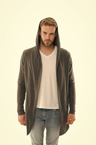 Trend setter is here. Serious guy isolated on white. Handsome guy in casual style. Unshaven guy wear hood. Fashion look of modern guy. Menswear store. Fashion and style - 写真・画像