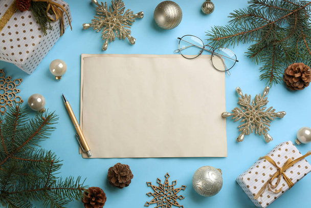 Flat lay composition with blank sheets of paper on light blue background, space for text. Writing letter to Santa - Фото, изображение