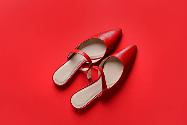 Female shoes on color background - Фото, зображення