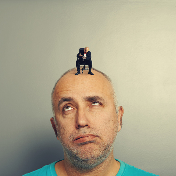 lazy man with small angry businessman - Photo, Image