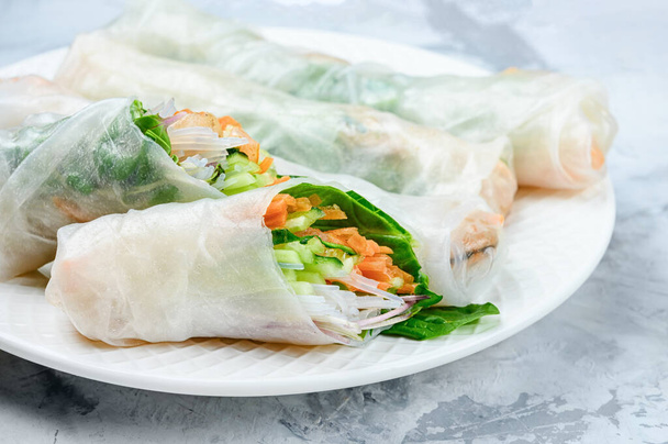 Spring rolls close up. A healthy dish with vegetables and shrimps - Фото, зображення
