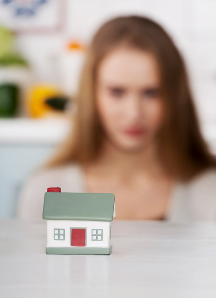 Woman and small house model. - Photo, Image