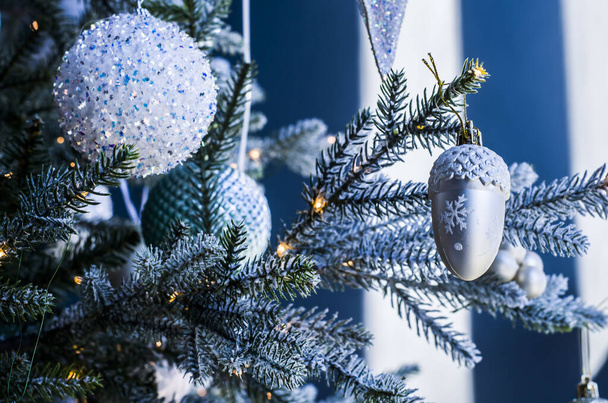 Christmas balls of on a blurred background, decorated with a silver branch. Photo for the New Year banner - Foto, afbeelding