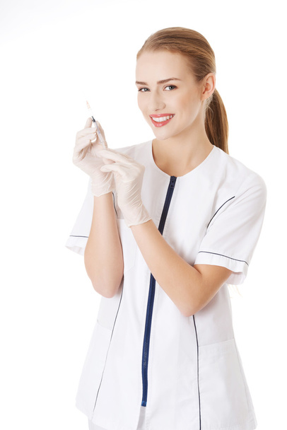 Nurse or doctor with needle - Foto, imagen