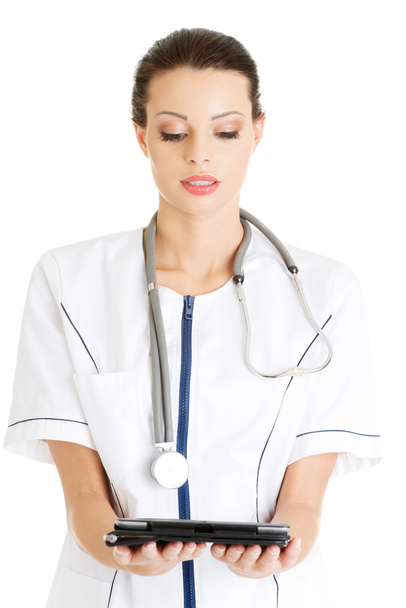Sexy nurse holding medical tray. - Foto, Imagen
