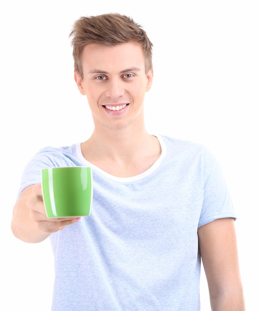 Portrait of handsome young man with cup, isolated on white - Foto, immagini