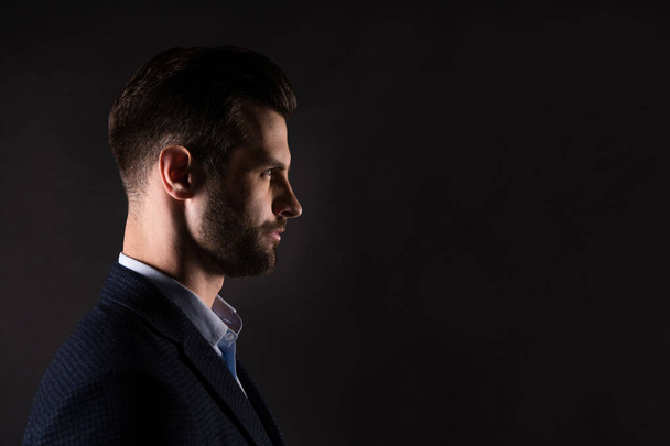 Close-up profile side view portrait of his he nice attractive man professional director corporate partner company owner isolated over dark black pastel color background - Fotografie, Obrázek