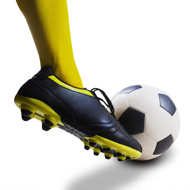 Foot kicking soccer ball isolated - Foto, afbeelding