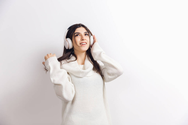 Portrait of beautiful woman isolated on white studio background. Comfort, warm in winter concept - Φωτογραφία, εικόνα