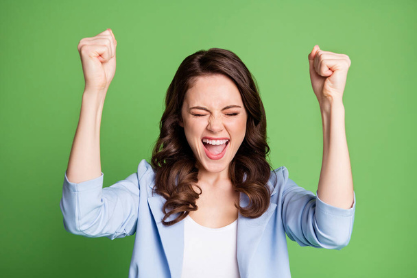 Photo portrait of young happy cheerful female employee shouting loudly wearing blue formal jacket isolated on bright green colour background - Fotografie, Obrázek